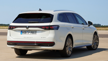 The new 2024 VW Passat Variant in white in a static rear shot with a blue sky background