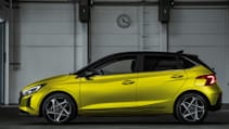 Side profile of new Hyundai i20 in hot lime colour