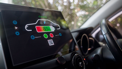 A monitor inside an electric vehicle showing a level of charge 