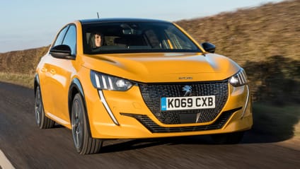 Driving shot of a sporty yellow Peugeot 208