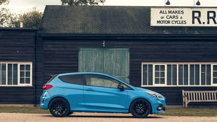 2018 Fiesta in side profile shot with old-school garage backdrop