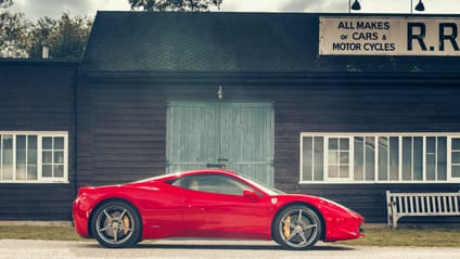 458 Italia in side profile shot with old-school garage backdrop