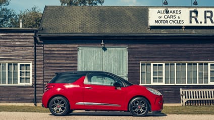 DS3 in side profile shot with old-school garage backdrop