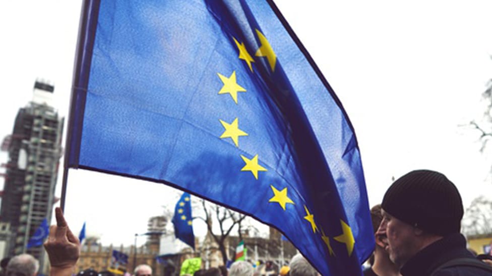 European Union flag in man's hand