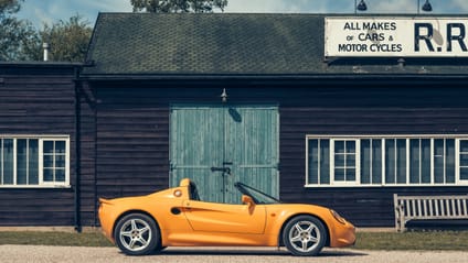 1996 Lotus Elise S1 in side profile shot with old-school garage backdrop