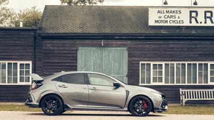 2017 Honda Civic Type R in side profile shot with old-school garage backdrop