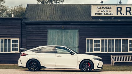 Type R FL5 in side profile shot with old-school garage backdrop