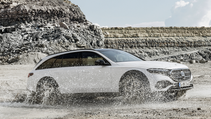 Driving shot of the Mercedes Benz E-Class All-Terrain estate, sand being flicked up around wheels