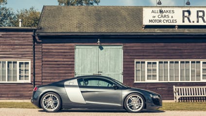 R8 in side profile shot with old-school garage backdrop