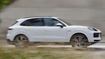 Side profile driving shot of the Porsche Cayenne S E-Hybrid