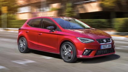 Driving shot of a red Seat Ibiza