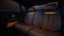 Static studio shot of Rolls-Royce Black Badge Ghost Ekleipsis rear seats