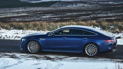 Driving shot of Mercedes-Benz AMG GT 4-door saloon in snow