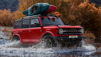 Driving shot of a Ford Bronco fording water