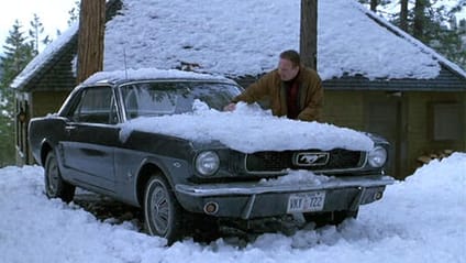 1966 Ford Mustang parked in snow with plenty on bonnet, scene from Stephen King's Misery