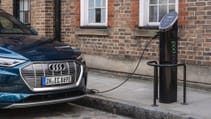 Close up of Pod Point EV charge point on-street hooked up to Audi