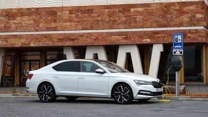 Static shot of the Skoda Superb iV parked and charging