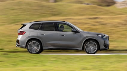 Side profile driving shot of BMW X1