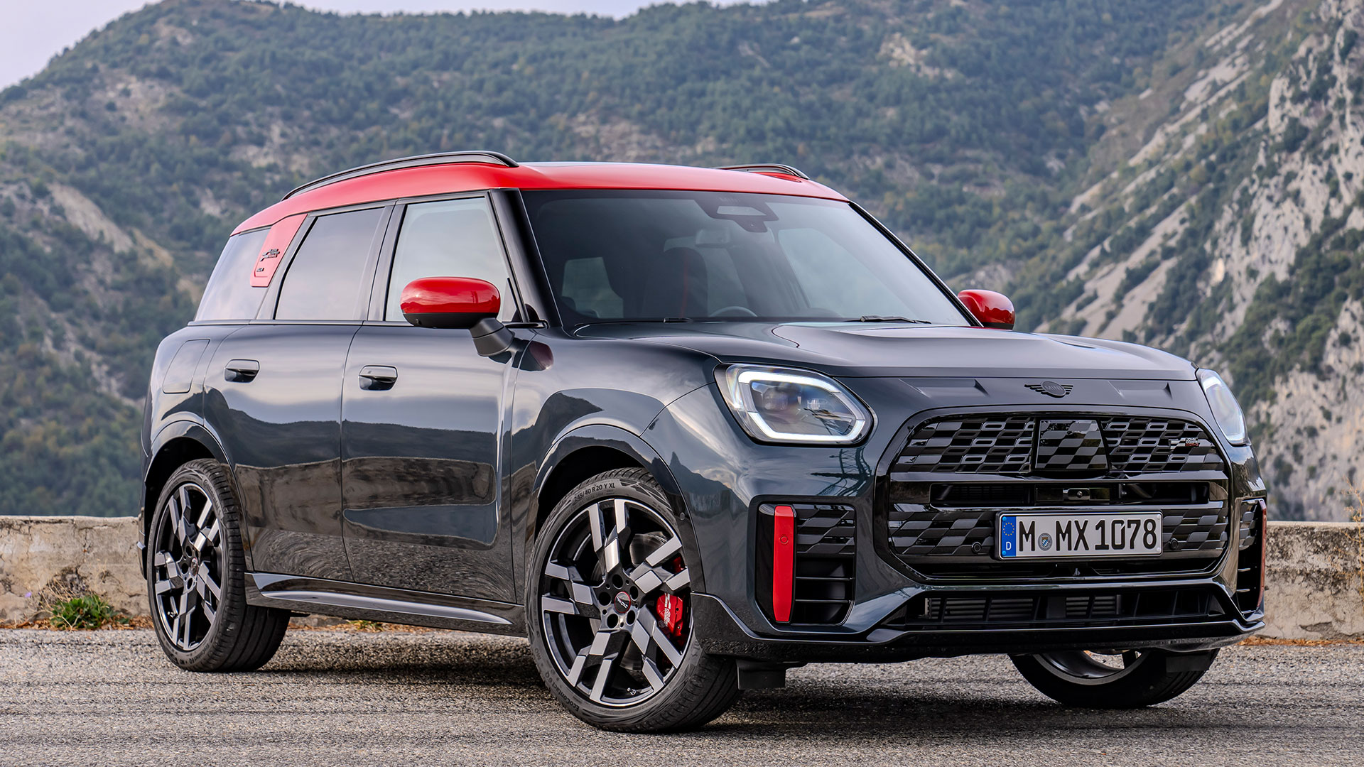 Static shot of new Mini Countryman John Cooper Works, front three quarter, with mountainous backdrop