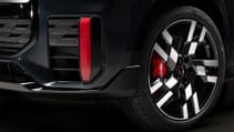 Close up shot of red accented air intake and brake calipers on new Mini Countryman JCW