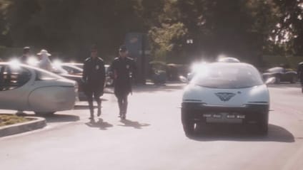 GM Ultralite from Demolition Man, driving out a car park while Sylvester Stallone walks with a colleague