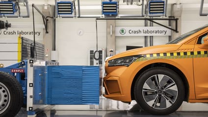 Euro NCAP lab with orange car undergoing crash for assessment