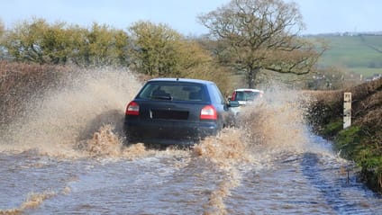 Car driving on flooded road