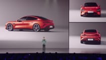 Xiaomi chief Lei Jun on stage presenting debut car SU7