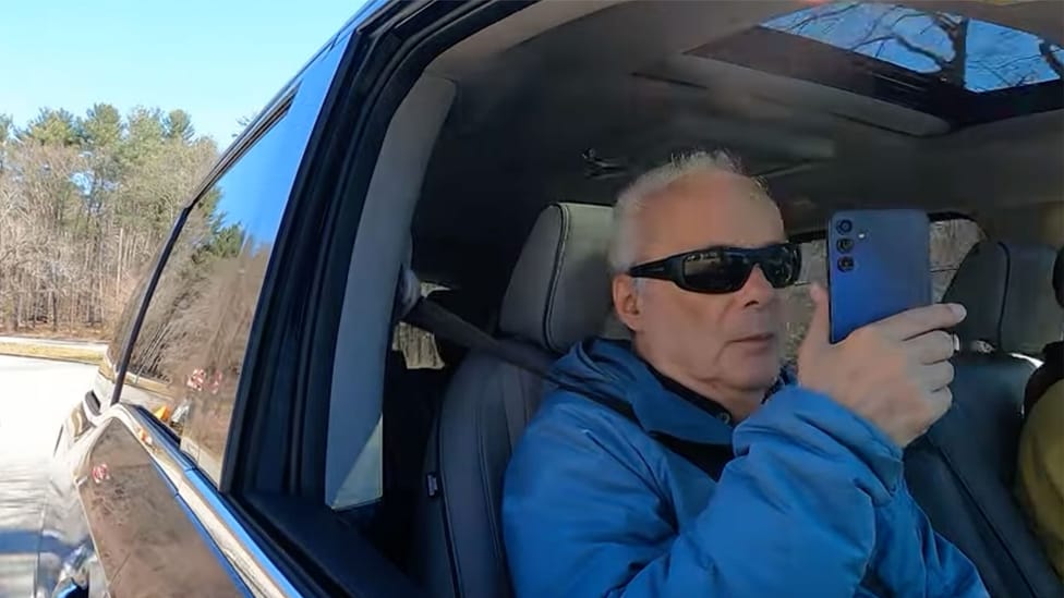 Blind man listens to Honda Scenic Audio app while on a car journey