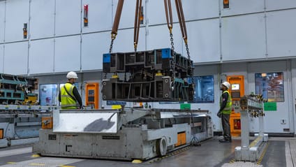 One of the 741 dies being put into the press shop with a crane