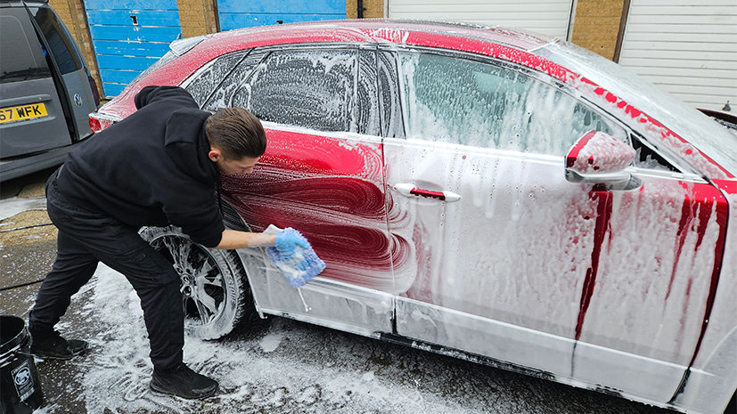 Someone cleaning the exterior of their car