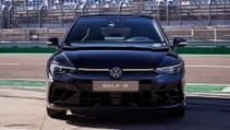 The 2024 Golf R Black Edition on track pit lane, dead-on front shot