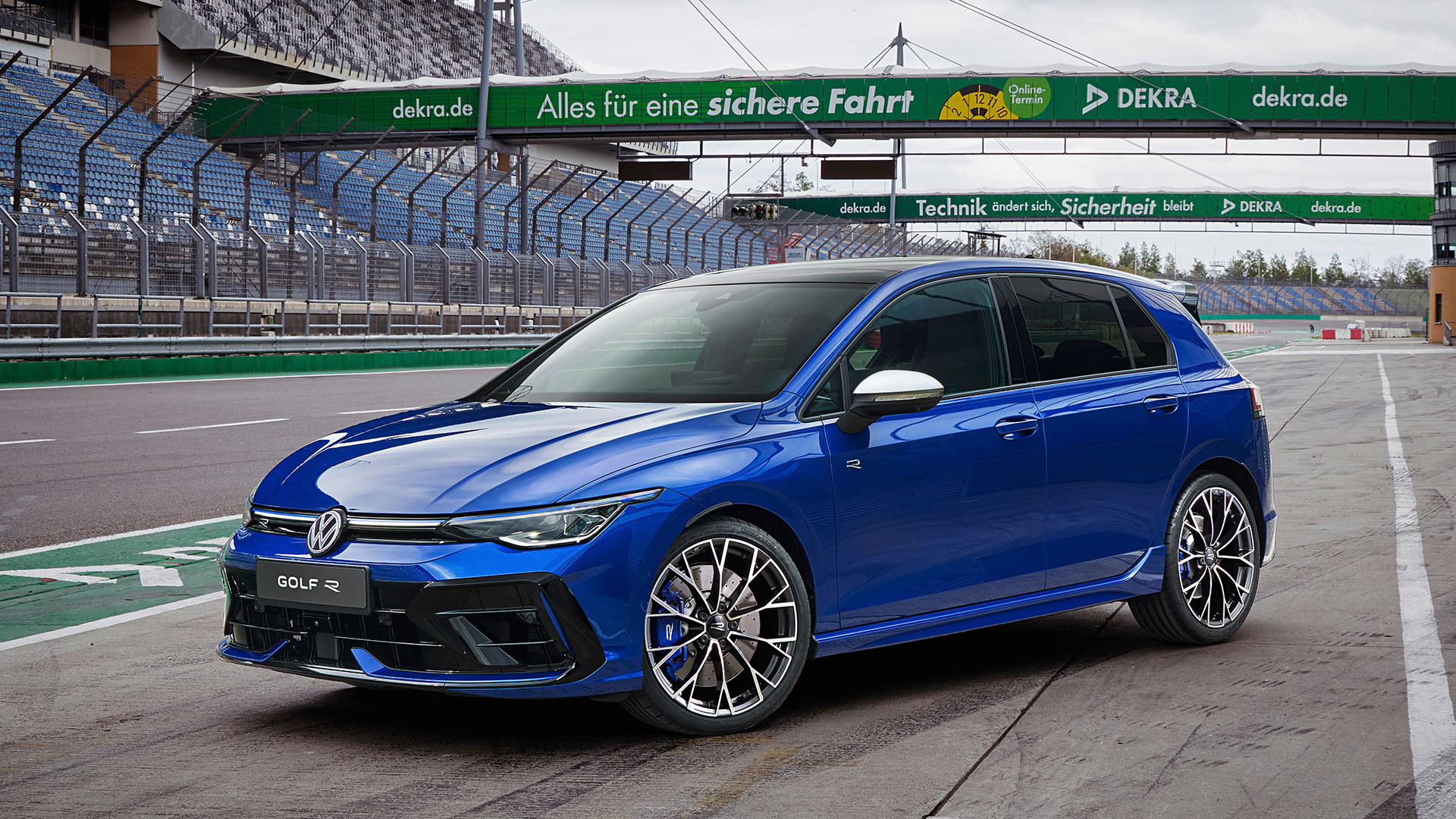 The 2024 Golf R in blue on track pit lane, static shot