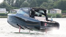 The Candela C-8 DC on water with hydrofoils deployed, shot from side