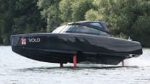 The Candela C-8 DC on water with hydrofoils deployed, in profile