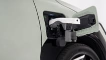 Kia EV3 - close up of charging port, with adapter for vehicle-to-load port