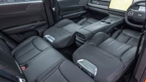 Shot of Xpeng G6's front seats fully reclined showing versatility of cabin