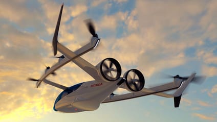 Image of Honda's eVTOL aircraft in a sunset sky with clouds in the backdrop