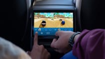 The 2025 Tesla Model Y Juniper features a rear screen with games for entertainment (pictured)