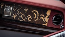 Wider shot of the in-laid dragon marquetry in-laid on the wooden dash of the Rolls Royce Phantom Dragon