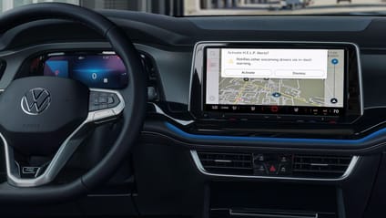 Close up of VW's Car-Net screen taken from rear seat looking at wheel and central dash screen