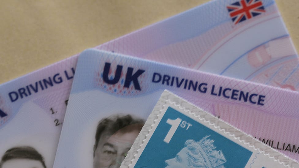 Photocard driving licences fanned out with UK stamps