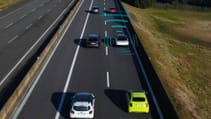 View of vehicles on a motorway, with graphics around one indicating the self-driving sensors