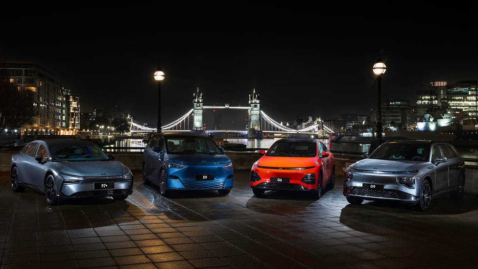 Xpeng range pictured against a backdrop with Tower Bridge, London - at night