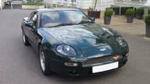 Static shot of 1995 Aston Martin DB7 from front three quarter