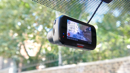 Static shot of a dashcam filming the street while the car is parked