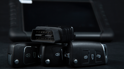 OBD II port sitting on top of a car key