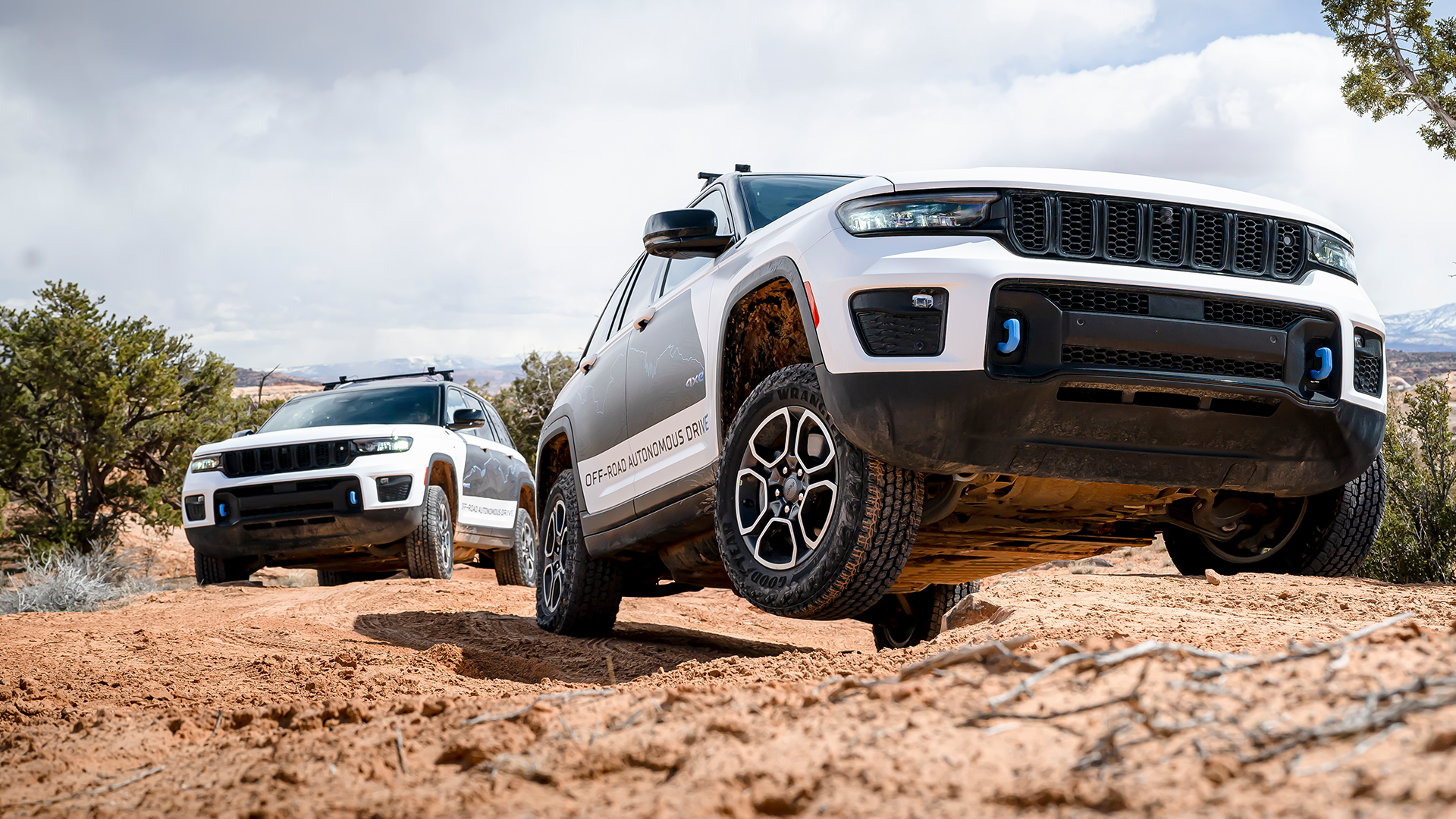 Two Jeeps off-roading in the desert - shot from a low angle