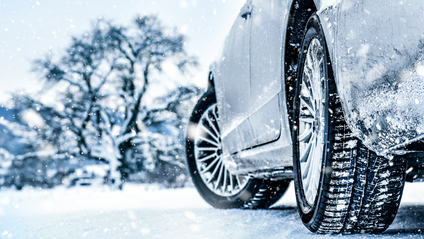 Car in winter showing tyre tracks