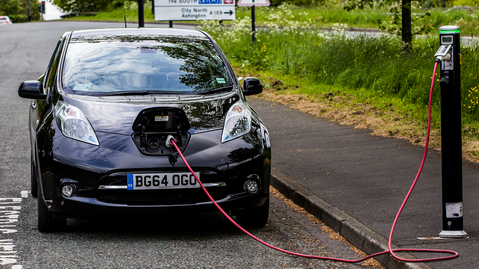 Nissan Leaf charging at a public charge point in the UK